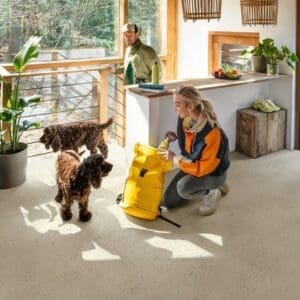 Sunlit extension with wooden ceiling and Quick-Step Pebble Concrete flooring