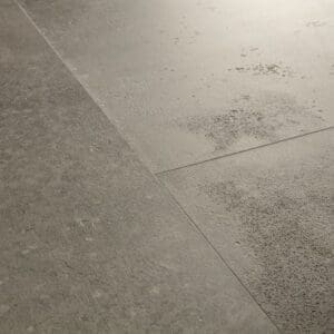 Close-up of Quick-Step Cloudy Concrete flooring showing detailed texture and subtle variations
