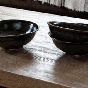 Close-up of ceramic bowls on Quick-Step Havana Oak Natural laminate flooring