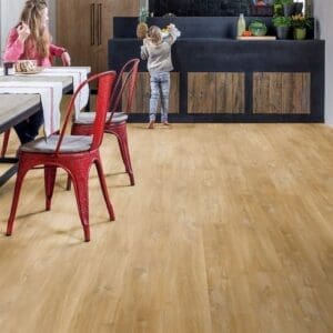 Modern kitchen with Canyon Oak Natural flooring and red metal dining chairs