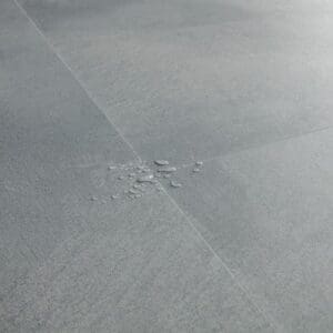 Quick-Step Soft Sky flooring installed in a modern living room with contemporary furniture