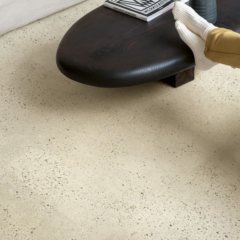 Close-up of Quick-Step Pebble Concrete flooring showing terrazzo-inspired pattern