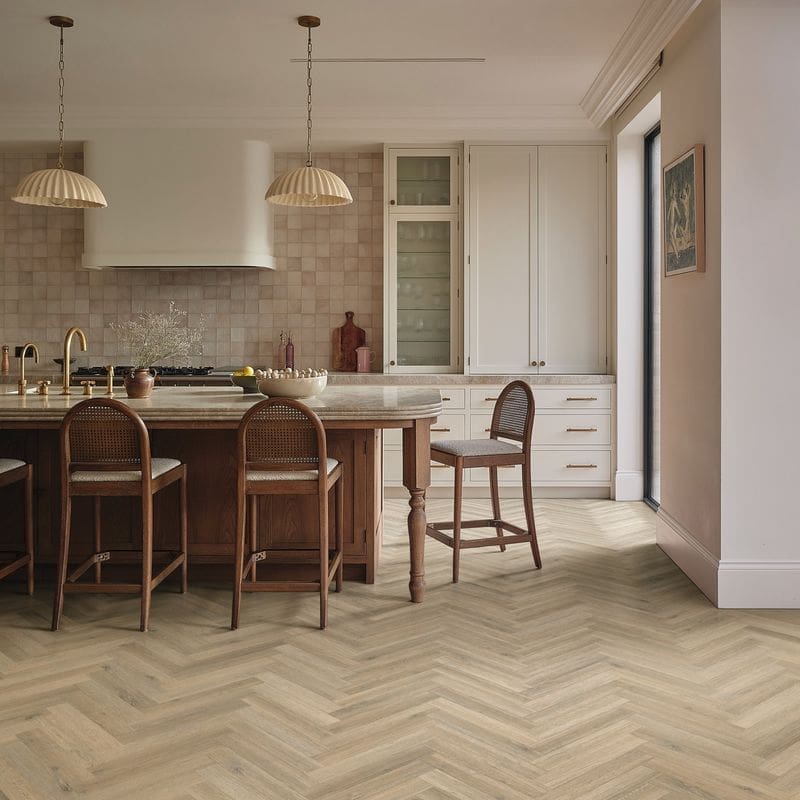 Sorrento oak herringbone flooring installed in modern kitchen with wooden island