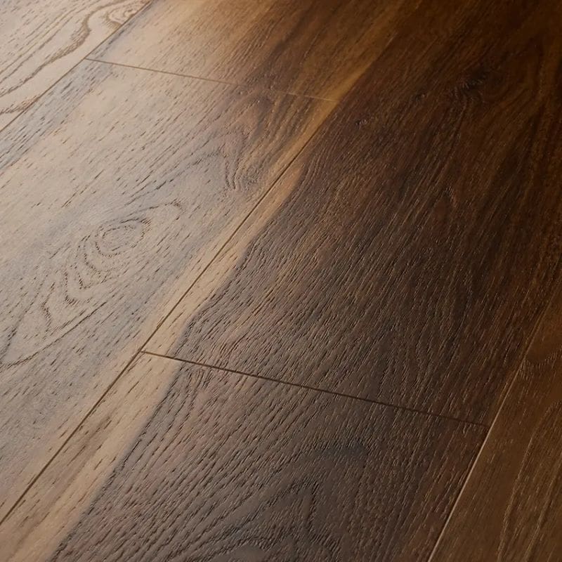 Close up view of textures warm walnut plank showing beveled edges and grain detail