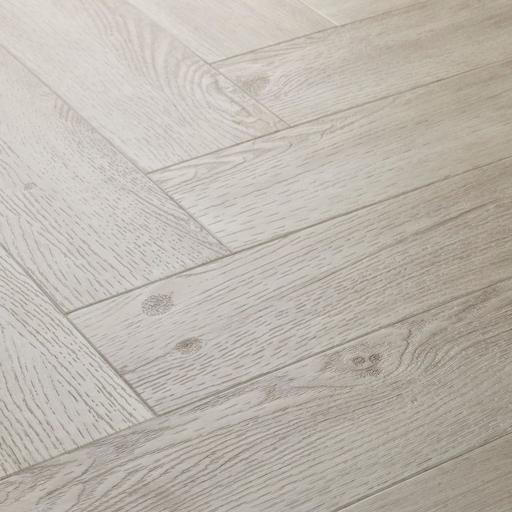 Elements Inspirations White Ash Herringbone EIH11 luxury vinyl flooring close-up showing the herringbone pattern.
