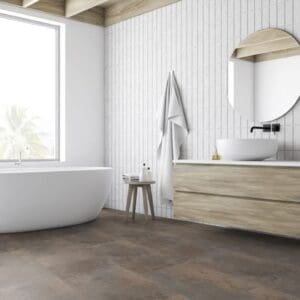 Modern bathroom featuring Oxyde Rust vinyl flooring with a white freestanding bathtub