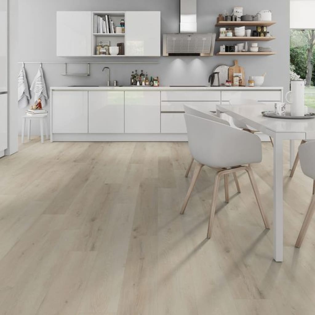 Bright kitchen and dining space installed with Prestige Oak White wood effect planks