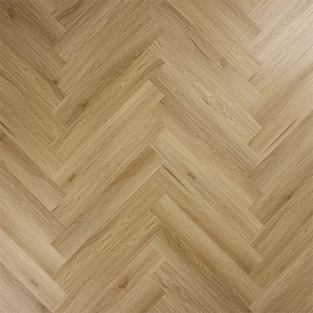 A top down view of Abingdon Artisan Dryback Weathered Cedar luxury vinyl tiles arranged in a herringbone pattern.