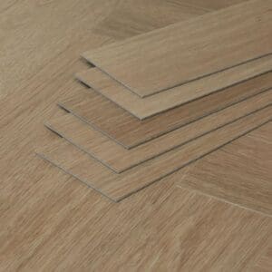 A stack of individual Bridle Oak vinyl planks showing the 3mm thickness and profile.