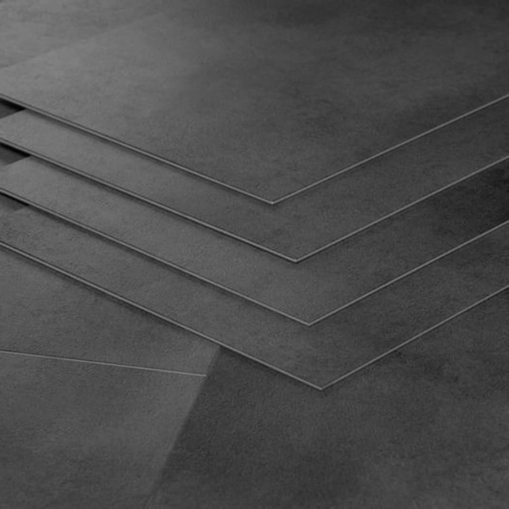 Close up stack of Nordikka Naturals Anthracite LVT tiles showing thickness