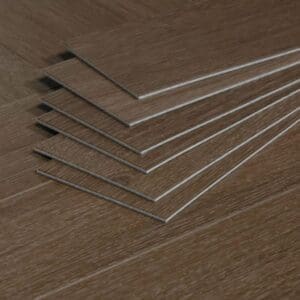 A stack of individual Roasted Walnut LVT planks showing the thickness and profile