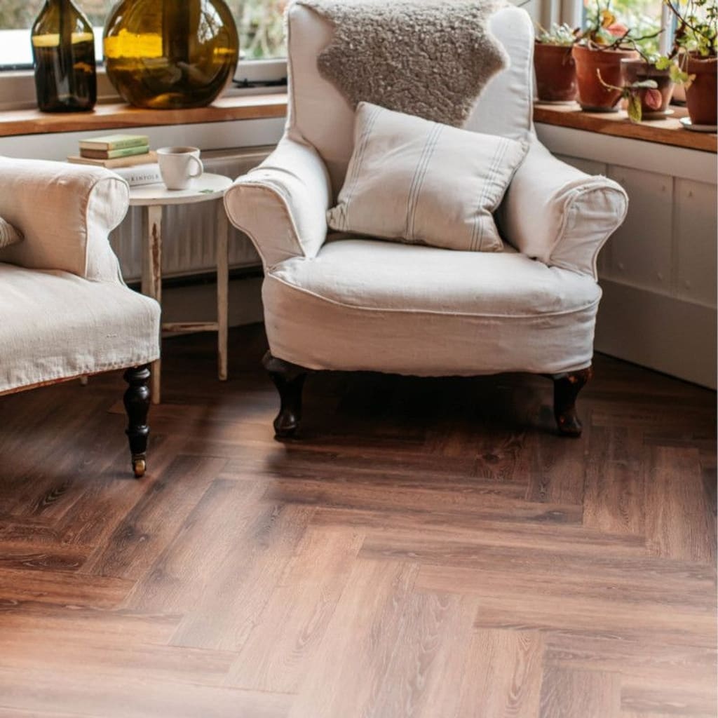 Overhead view of Toasted Oak herringbone pattern with a small white table