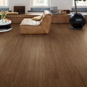 Close-up of Quick-Step Capture Chic Walnut laminate flooring showing detailed wood grain pattern