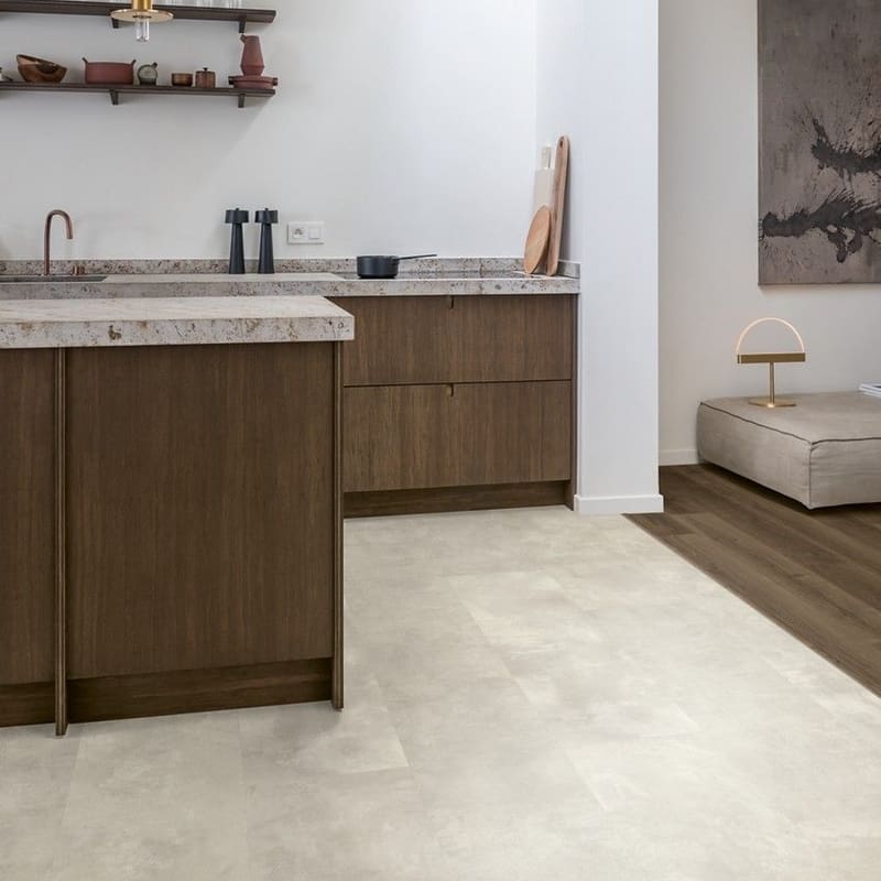 Modern kitchen with Quick-Step Muse Stained Concrete flooring and wooden cabinetry