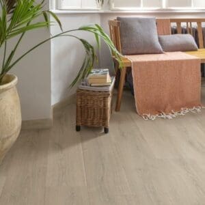 Close-up detail of Quick-Step Brushed Oak Beige laminate flooring showing grain texture