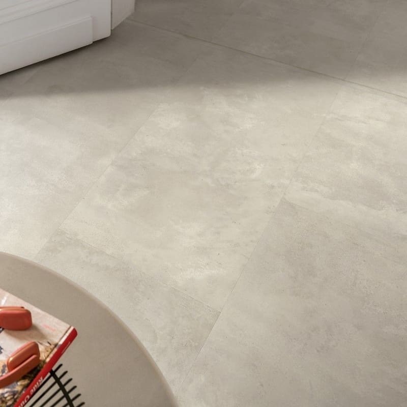 Close-up of Quick-Step Muse Stained Concrete flooring near doorway showing transition