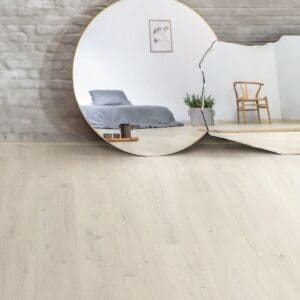 Contemporary kitchen with island and Soft Patina Oak laminate flooring