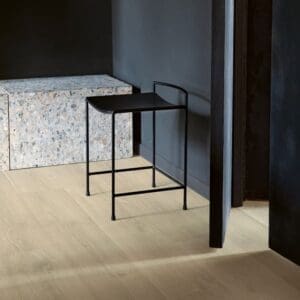 Entryway with Quick-Step Brushed Oak Beige laminate flooring and wooden bench