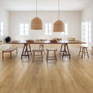 Quick-Step Capture Brushed Oak Warm Natural laminate flooring in an elegant dining room with ornate ceiling