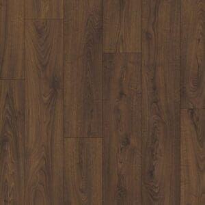 Quick-Step Classic Peanut Brown Oak laminate flooring sample showing rich wood grain pattern and texture