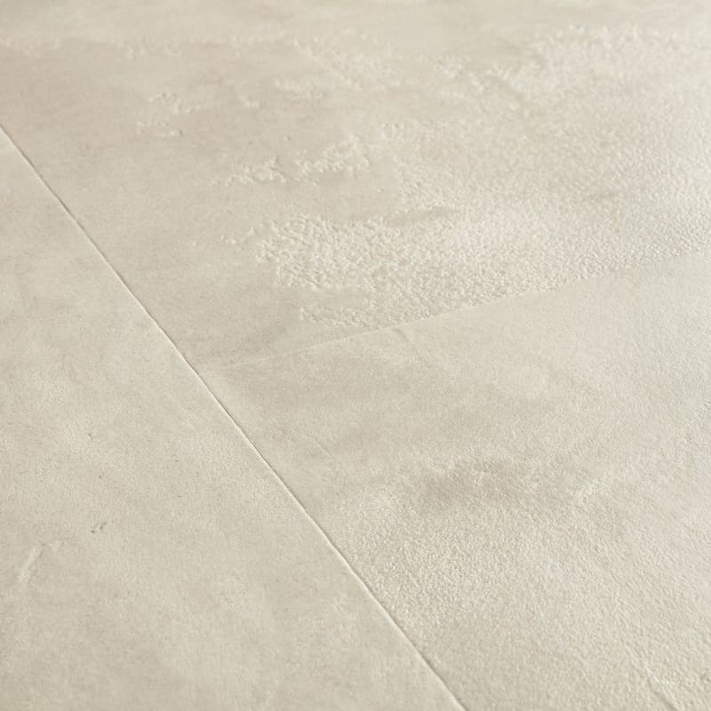 Close-up of water droplets on Quick-Step Muse Stained Concrete flooring from another angle