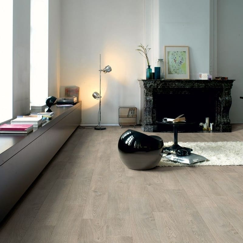 Living room with Quick-Step Classic Old Oak Light Grey laminate flooring, featuring modern furniture and fireplace