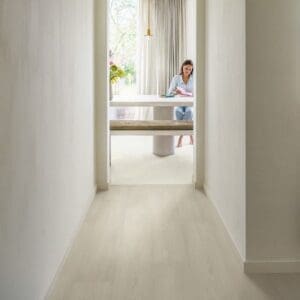 Hallway with Quick-Step Muse Chalk Laminate Flooring MUS5487 showing bright, clean aesthetic