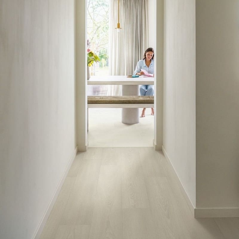 Hallway with Quick-Step Muse Chalk Laminate Flooring MUS5487 showing bright, clean aesthetic