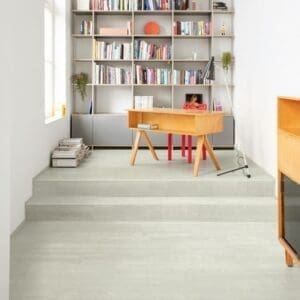 Bedroom with Quick-Step Alpha Bloom Snow Pine flooring creating a bright, airy atmosphere