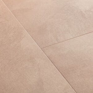 Close-up of Quick-Step Soft Blush vinyl flooring showing water resistance properties