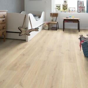 Quick-Step Creo Tennessee Oak Light Wood laminate installed in a child's bedroom