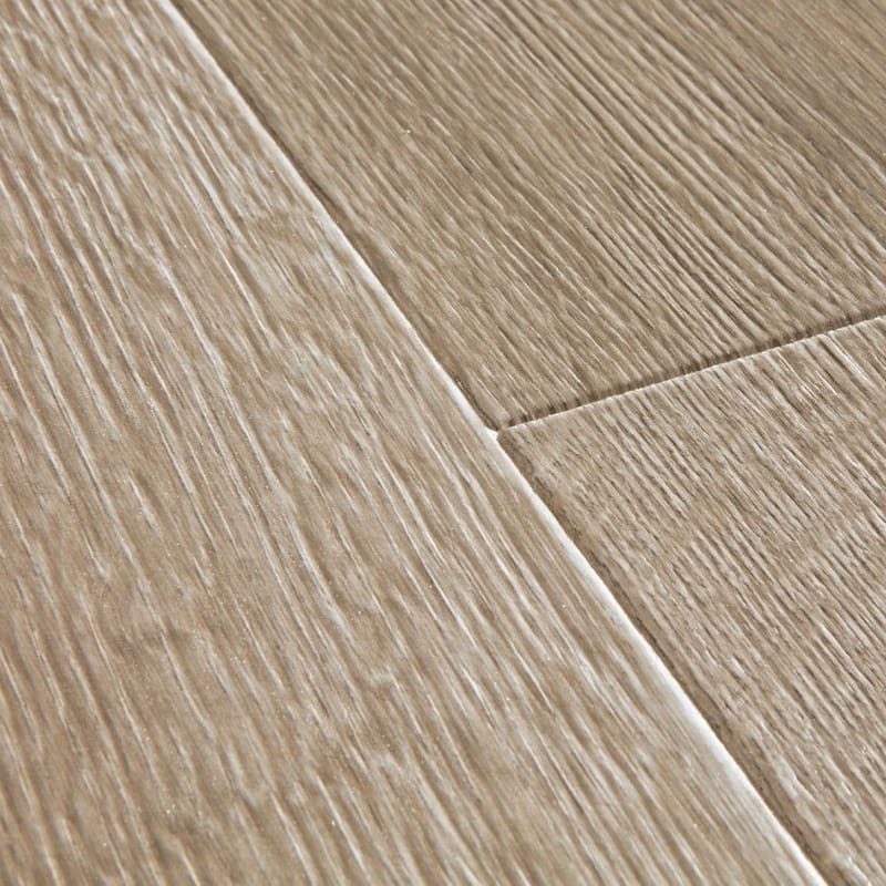 Close-up of Quick-Step Majestic Desert Oak Brushed Grey laminate flooring showing textured surface and plank joints