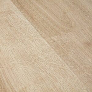 Close-up of Quick-Step Creo Virginia Oak Natural laminate flooring showing detailed wood grain texture and light natural oak coloring