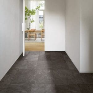 Hallway with Quick-Step Muse Grey Slate Laminate flooring leading to dining area
