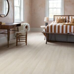 Bedroom interior with White Premium Oak flooring and striped bedding