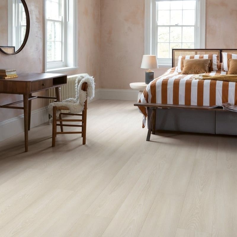 Bedroom interior with White Premium Oak flooring and striped bedding