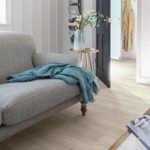 Quick-Step Capture Brushed Oak Grey laminate flooring in a dining area with natural light