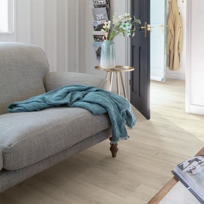 Quick-Step Capture Brushed Oak Grey laminate flooring in a dining area with natural light