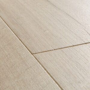 Close-up detail of Quick-Step Soft Oak Light laminate flooring showing beveled edge and wood grain texture