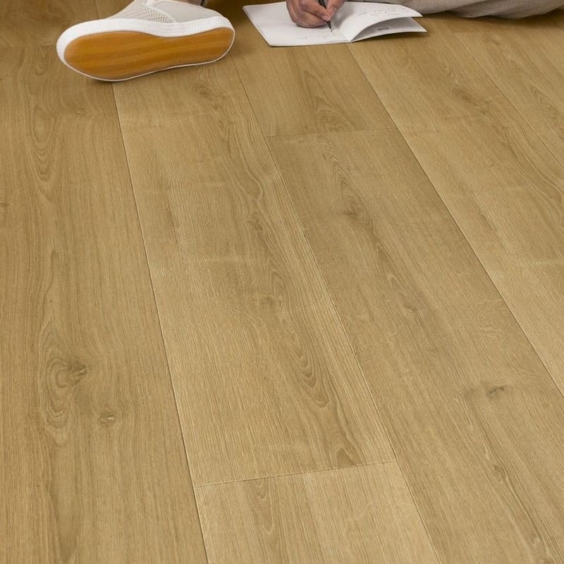 Close-up of Quick-Step Capture Brushed Oak Warm Natural laminate flooring showing water resistance