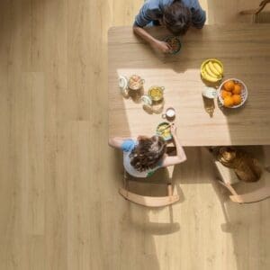 Close-up of Quick-Step Brushed Oak Beige flooring showing water resistance properties