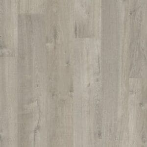 Close-up of Quick-Step Impressive Soft Oak Grey laminate flooring showing authentic wood grain texture and beveled edges