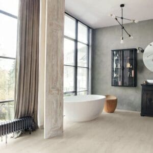 Modern bathroom with freestanding tub and Soft Patina Oak laminate flooring