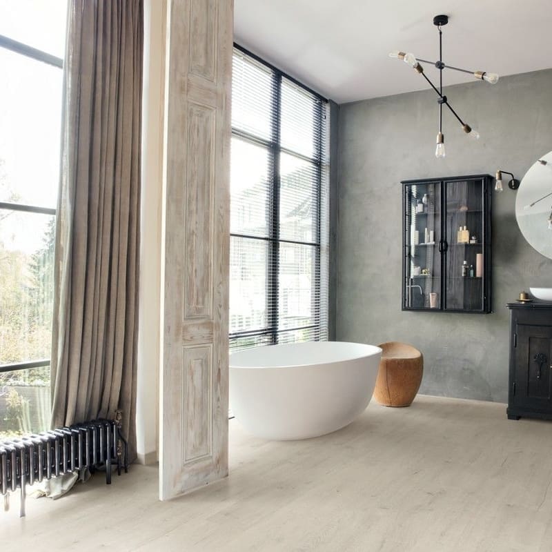 Modern bathroom with freestanding tub and Soft Patina Oak laminate flooring
