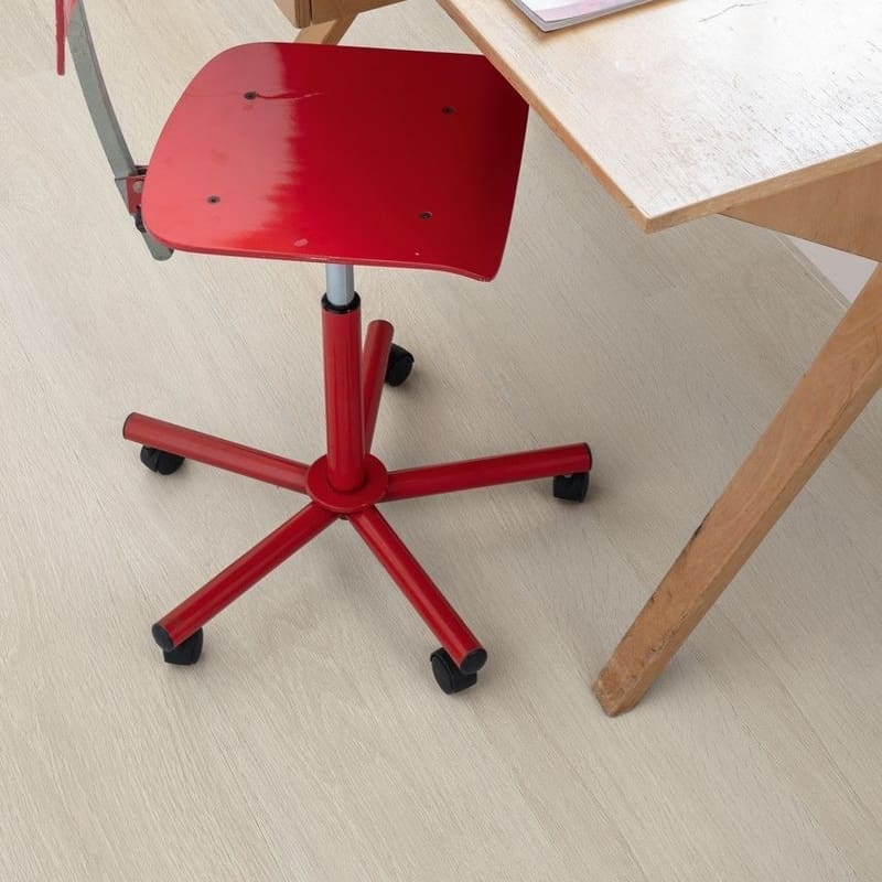 Home office with wooden desk, red chair and light oak vinyl flooring