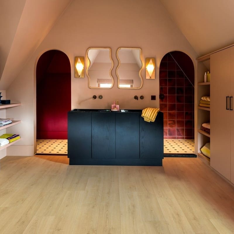 Full room view of Quick-Step Capture Brushed Oak Natural laminate flooring showing plank layout and natural oak appearance