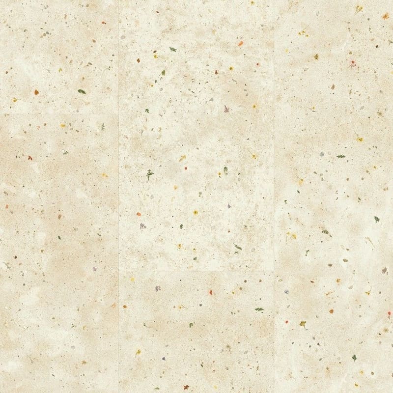 Close-up of Quick-Step Muse Botanic Concrete laminate flooring showing cream base with colourful flecks