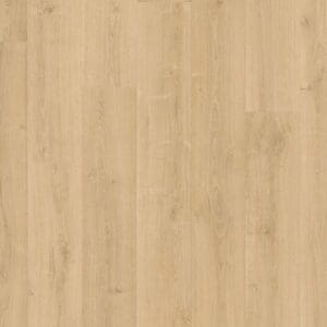 Full room view of Quick-Step Capture Brushed Oak Natural laminate flooring installed in a modern bathroom with blue cabinetry
