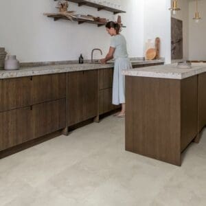 Close-up of water droplets on Quick-Step Grey Concrete Laminate flooring surface