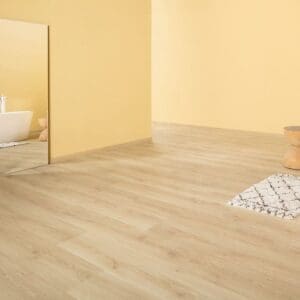 Hand soap and brush on Quick-Step Capture Brushed Oak Natural laminate flooring showing water resistance
